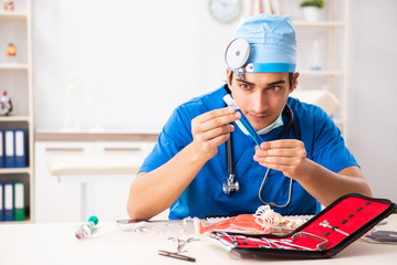 Mad doctor working in the clinic 