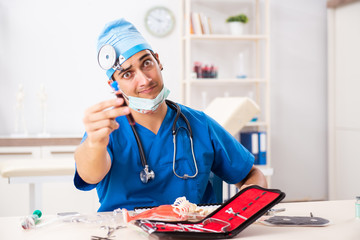 Mad doctor working in the clinic 