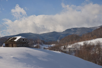 Fototapeta na wymiar Beautiful day of winter on magical wild Transylvania mountain hills.