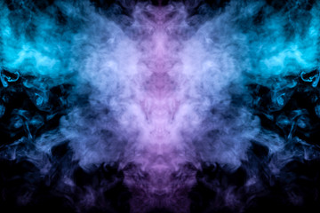 Fototapeta premium Abstract image of smoke of different green and pink colors in the form of horror in the form of the head of the face and eyes on a black isolated background. Soul and ghost in mystical form.