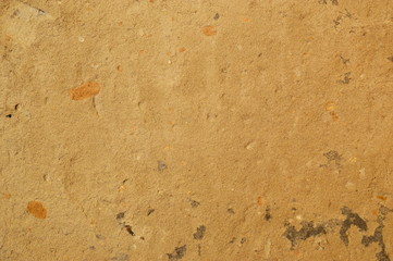 Plastered wall with sand texture. Yellow