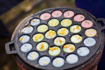 kind of Thai sweetmeat . Coconut milk mix with powder fried dessert. Making of Thai sweetmeat khanomkhrok. Local Thai food, Kind of thai sweetmeat,Thai  coconut pudding,Thai sweetmeat. kind, dessert.