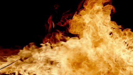 Fire show performer breathing fire in dark air, making cool performance - extreme slow motion