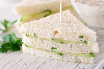 Summer snack mini sandwiches with cucumber and yogurt sauce