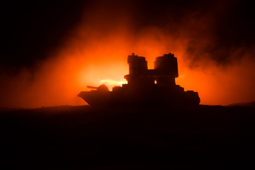 Obraz premium Sea battle scene. Silhouette of military war ship on dark foggy toned sky background. Explosion and fire. Dramatic scene decoration.