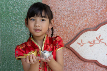 Asian adorable child girl In Chinese dress