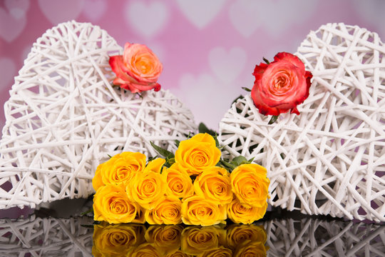 Wicker heart with yellow roses. Valentines Day