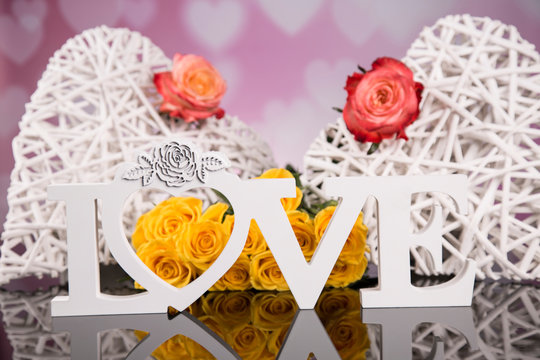 Wicker heart with yellow roses. Valentines Day