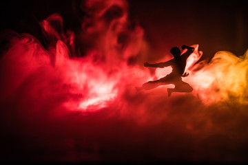 Karate athletes on the background of the Japanese flag.Character karate.silhouettes on a white background. Sports Scramble.