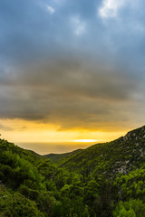 Greece, Zakynthos, Beautiful green valley down to the ocean in spectacular sun light