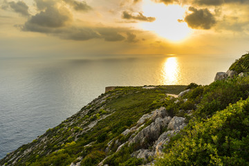 Greece, Zakynthos, Landscape at cape skinari in fantastic orange sunset sky light