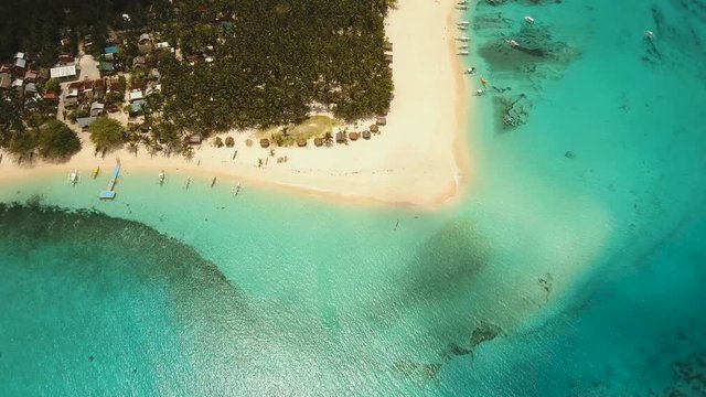 aerial footage tropical island with beach and palm trees lagoon with turquoise water Sea tropical landscape Daco island, Philippines, Siargao. Travel concept Aerial video