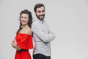 Relationship between man and woman. Man and woman stand back to back on a white background.