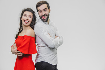 Relationship between man and woman. Man and woman stand back to back on a white background.