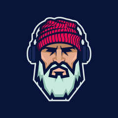 Bearded man in a knitted hat and headphones. DJ Hipster