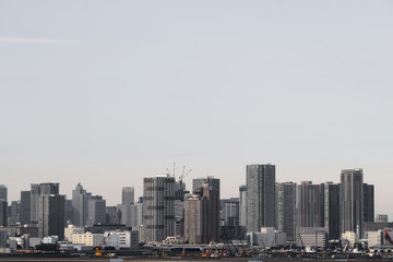 Fototapeta na wymiar A scenery of a high-rise apartment that stands on the waterfront in Tokyo