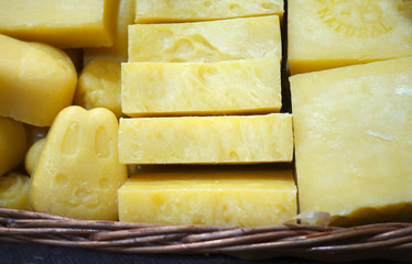 Pieces of natural soap in a wicker basket.