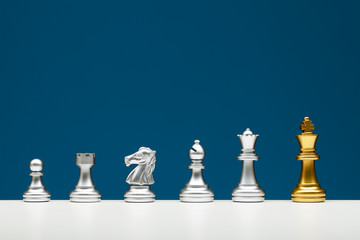 Chess board standing from the crowd concept