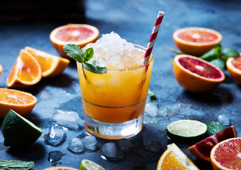 Refreshing cocktail with crashed ice, juicy summer drink with citrus fruits