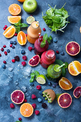 Colorful detox smoothie in bottles, summer diet fresh drink for breakfast or snack.