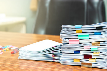 Document stacks arranged by various colored paper clips