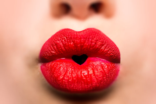 Love kiss. Lips with heart icon. Valentine's Day. Beautiful girl with red lipstick. Lip shape.