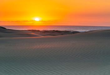 Fototapeta na wymiar Sunrise at Sand Dunes. Stockton Sand Dunes, Australia
