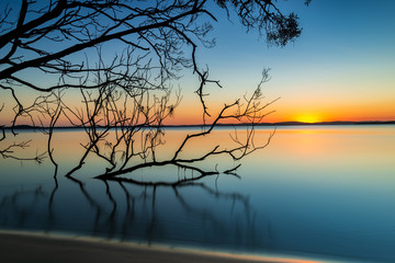 Sunset over calm water. Myall Lakes, Australia