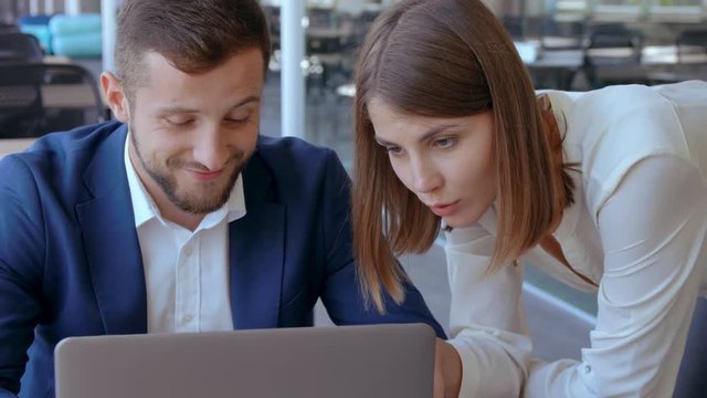 close up business team working on a presentation caucasian woman looking on screen computer. handsome businessman explaining his idea.