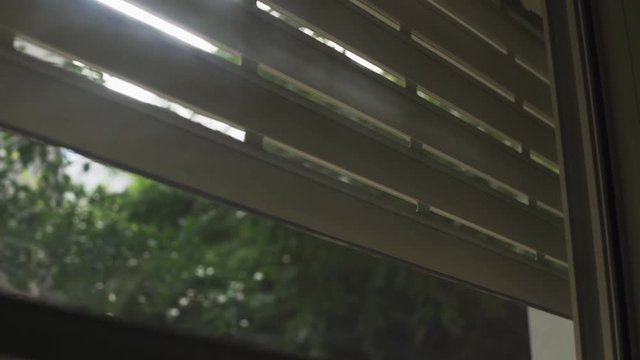 Electric shutter of a window being closed in a house