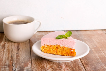 carrot cake with raspberry mousse, mousse dessert on a white plate