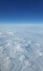 View from the window of the aircraft on the clouds