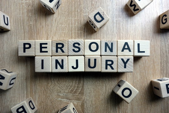 Personal Injury Text From Wooden Blocks On Desk