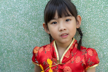 Asian adorable child girl In Chinese dress happy smile