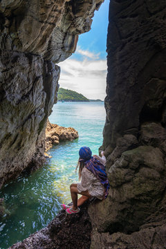Travel people women tourist in a cave near the sea in Keo Sichang, holiday and vacations tourist, Thailand. Travel Summer Concept