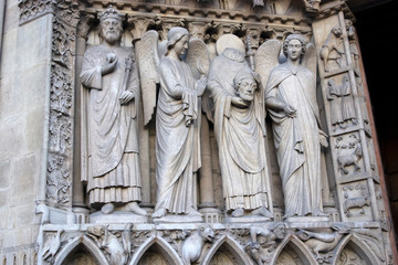 Fototapeta premium Close up to statues on facade of Notre Dame cathedral, Paris / France