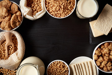 Soy products on black background, from above