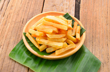 french fries on wood background