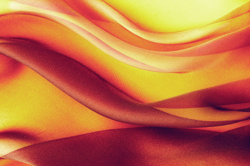 yellow red fabric with large folds,  abstract background