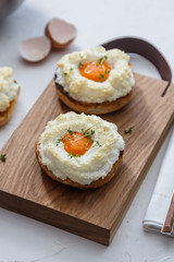 Orsini eggs, french cuisine, on wooden background, top view