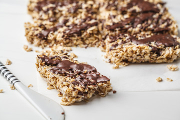 Homemade chocolate oatmeal bars on a white background. Healthy vegan dessert, detox food