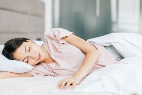 good looking girl sleeping in the bed, good night . healthy sleep, health care