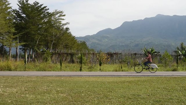 Woman ride a bicycle