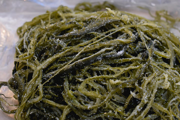 Stripes of fermented salted seaweed sold on a street market in Seoul Korea