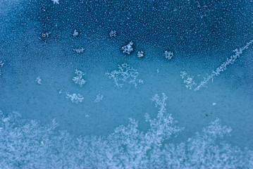 Ice flowers and crystals on the window