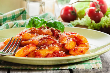 Italian gnocchi with tomato sauce and cheese