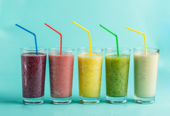 different kinds of yoghurt with perfect wonderful taste. isolated blue background. keeping fit