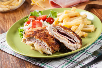 Cutlet Cordon Bleu with pork loin served with French fries and salad