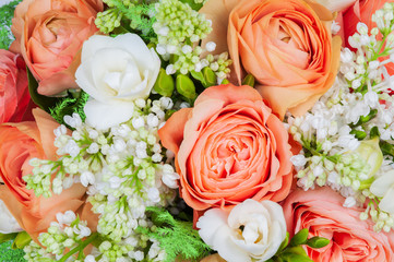 Elite spring bouquet with mimosa and other flowers, close up on a white background