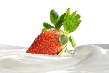 Plain yogurt with fresh strawberry on top isolated on white background